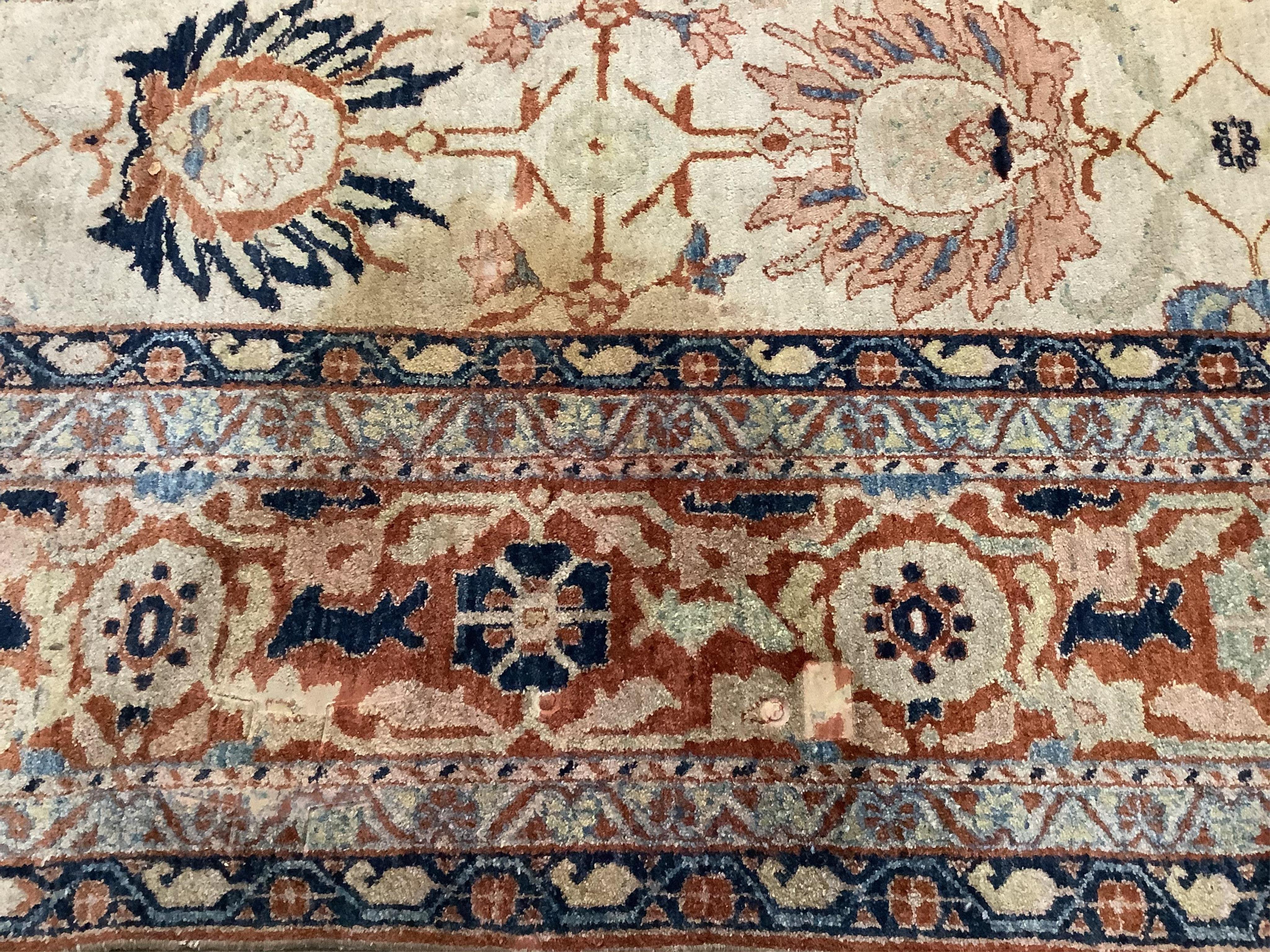 A Garous Zeigler style ivory ground carpet, 358 x 260cm. Condition - fair, one stained patch